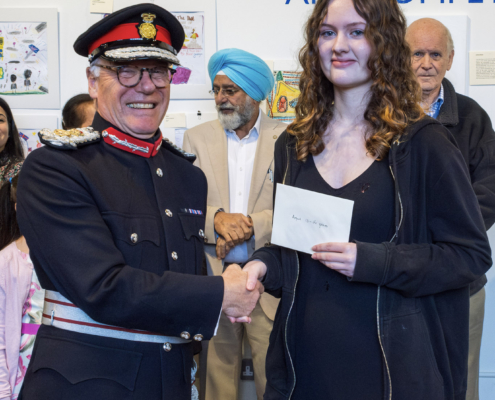 Winner of 13 - 16 Age Category receiving cash prize from HM Lord-Lieutenant