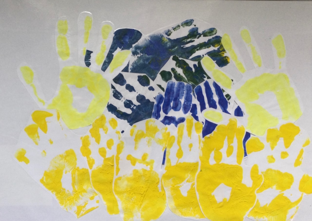 Winner - Group entry by the Caterpillar Pod - St Edward’s Crown - Castle Academy age 4-7 ( Young people with autism) A bright and cheerful gold and blue collage of painted hands drawn together to represent King Edward’s crown, used in the Coronation of the King.