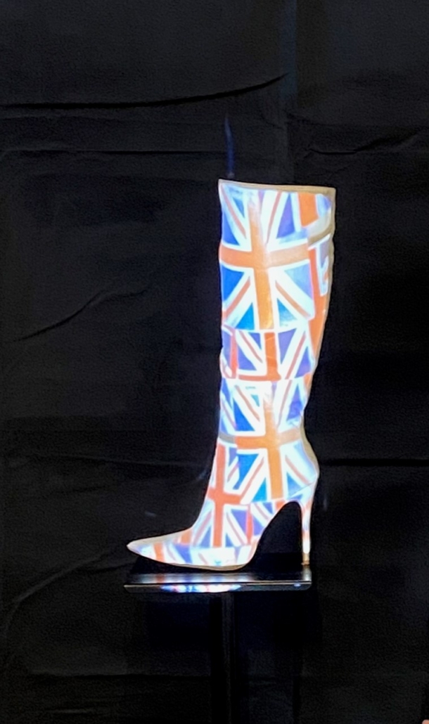 Winner of 10 - 12 yrs - Isla Marriott (Sponne School) Isla entered on her own account after she saw an advert for the competition. A very clever digital compilation of images to do with the coronation projected onto and exactly fitting the white boot which was placed in front of a black backdrop for maximum effect. The whole set to music. Very impressive.