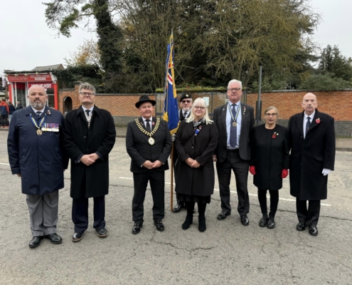 Deputy Lieutenant Guy Schanschieff MBE with Dignitaries on Thrapston Remembrance Day 2024