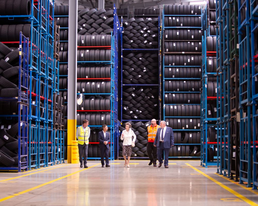Walking through the Warehouse at Hankook Tyres HRH The Princess Royal visit to Hankook Tyres UK Ltd